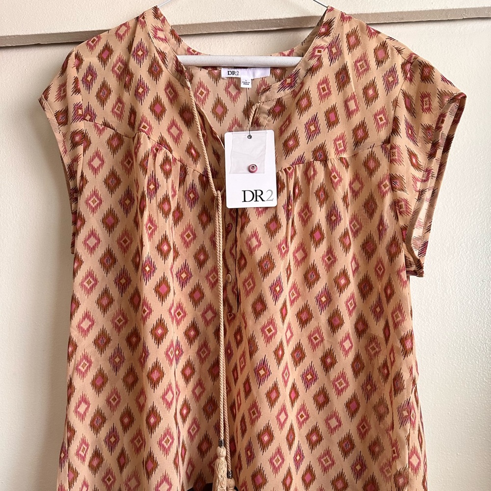 Light see through airy top.